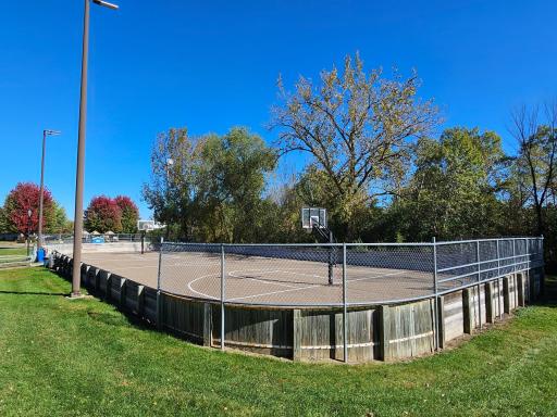 The basketball court in the warmer months is an ice rink maintained by the city in the winter months.
