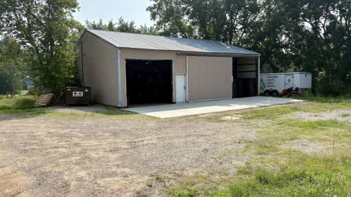 30x40 pole shed with new concrete apron and garage door opener
