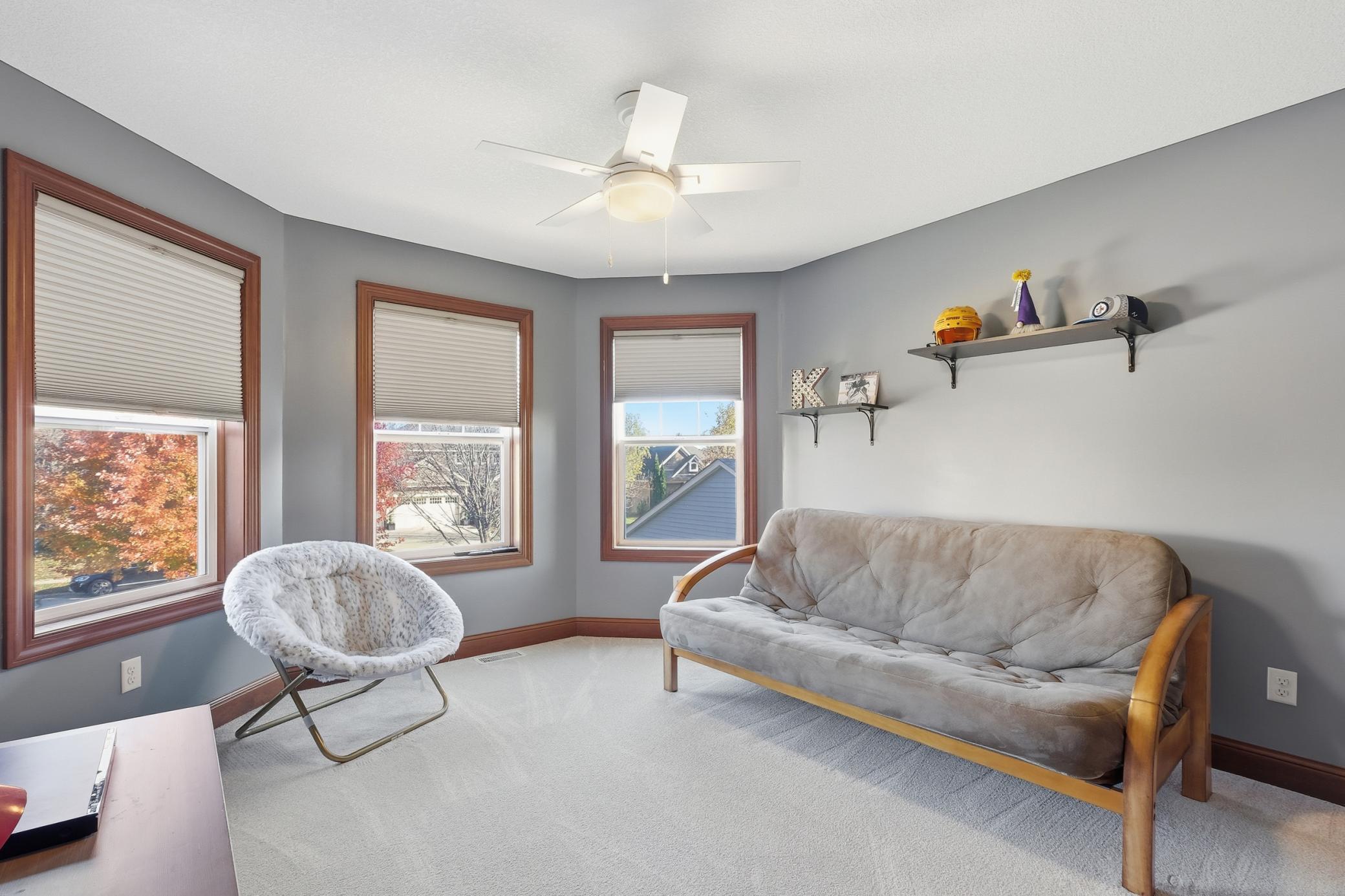 One of 4 bedrooms upstairs with bay windows.