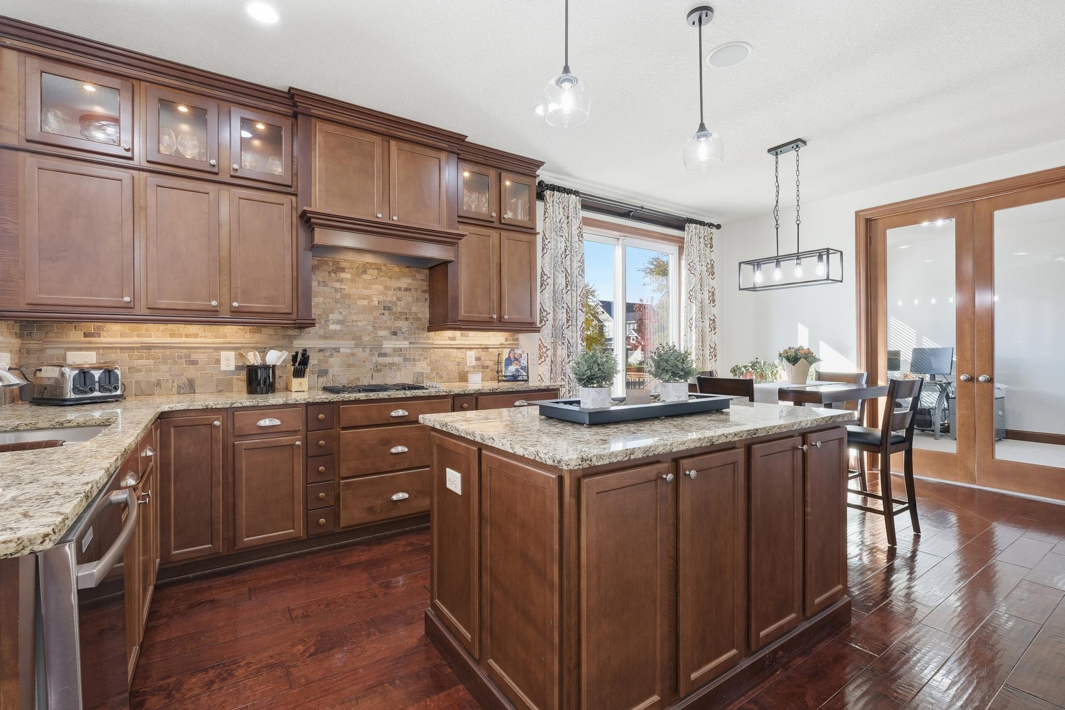 Plenty of cabinets and double ovens as well as a high quality gas range. New lighting throughout the main level.