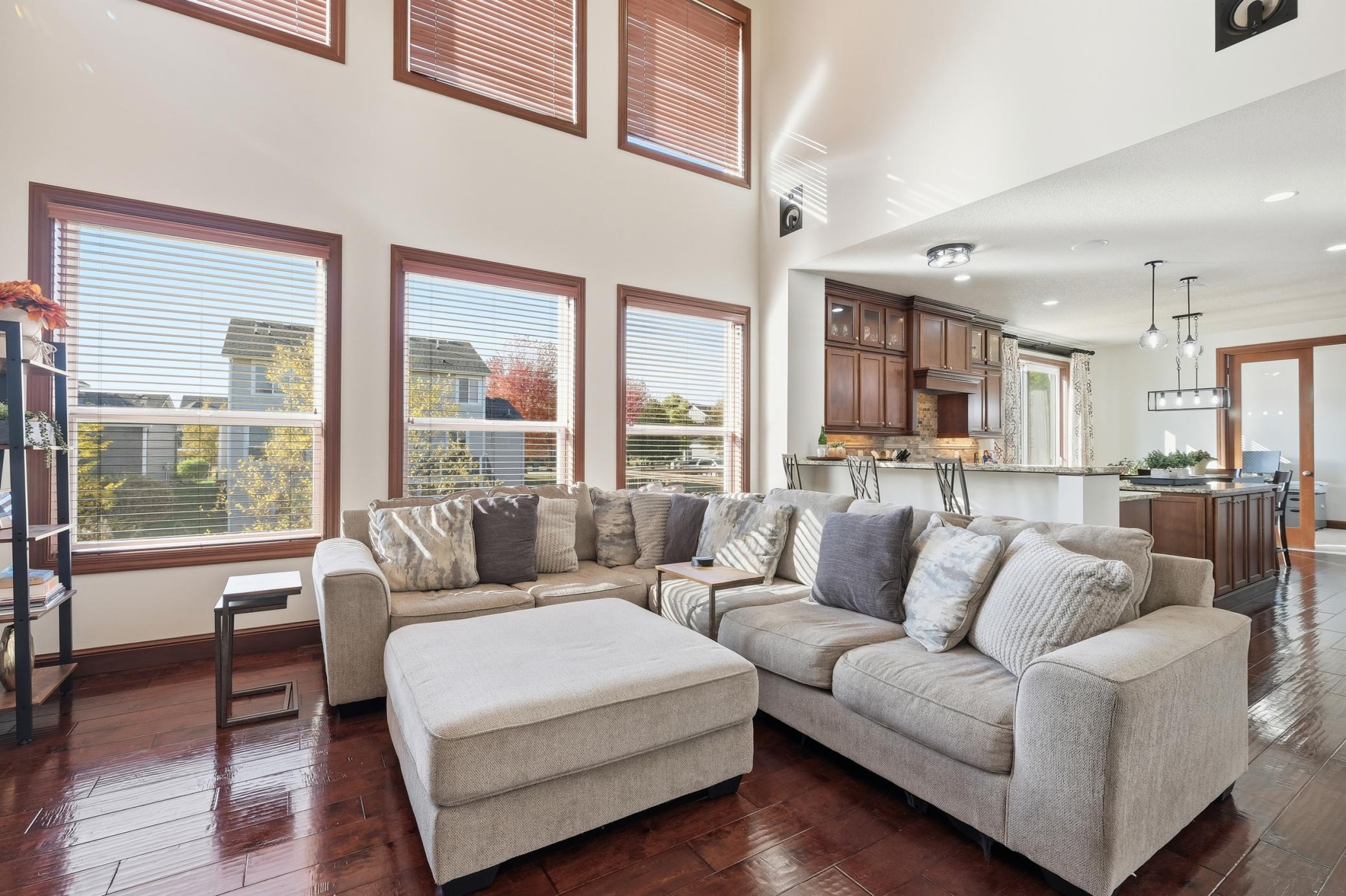 The great room with its built in surround sound system is open onto the kitchen.