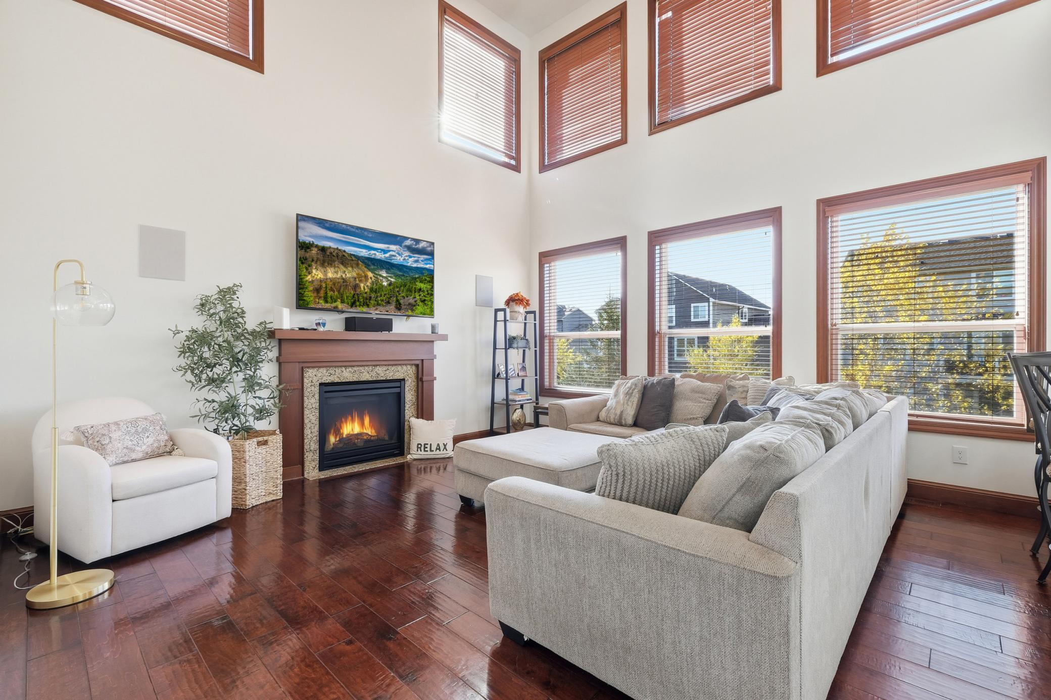 2 stories of windows allowing for that westerly light in the great room. Cozy up to the gas fireplace-appreciate the surround sound throughout the house.