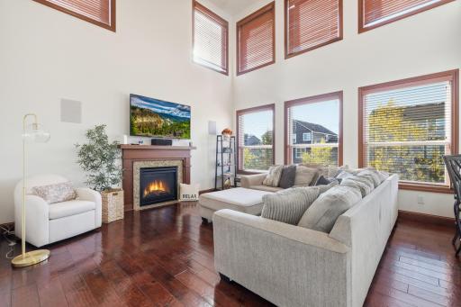 2 stories of windows allowing for that westerly light in the great room. Cozy up to the gas fireplace-appreciate the surround sound throughout the house.