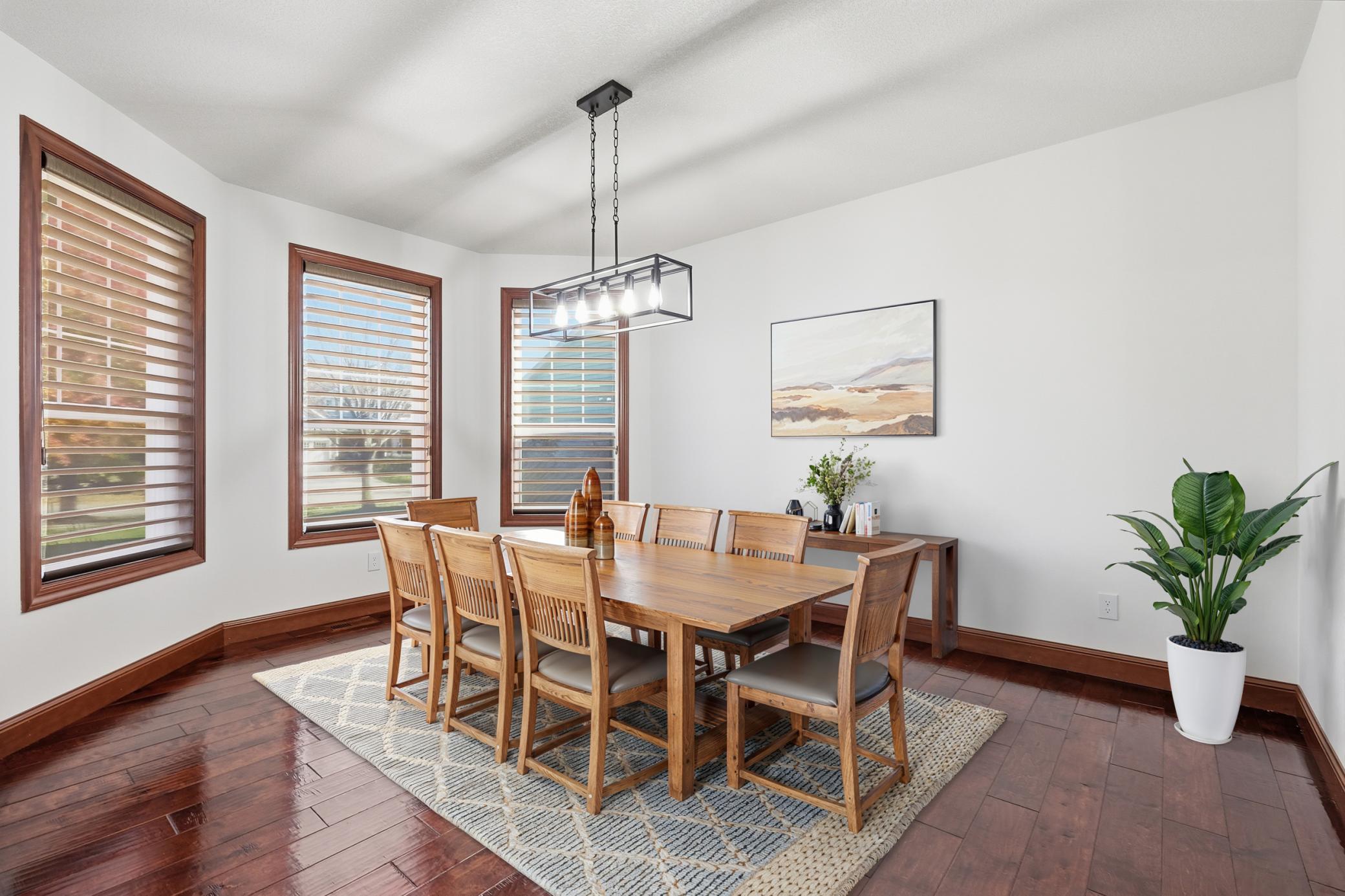 Virtually staged spacious dedicated dining room-