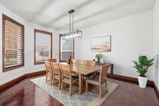 Virtually staged spacious dedicated dining room-