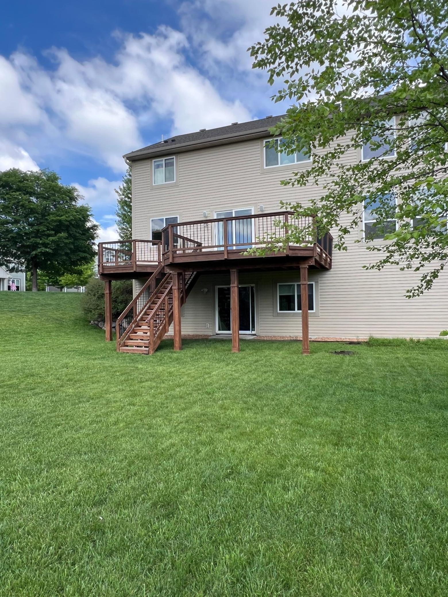 Another view of the spacious backyard and deck