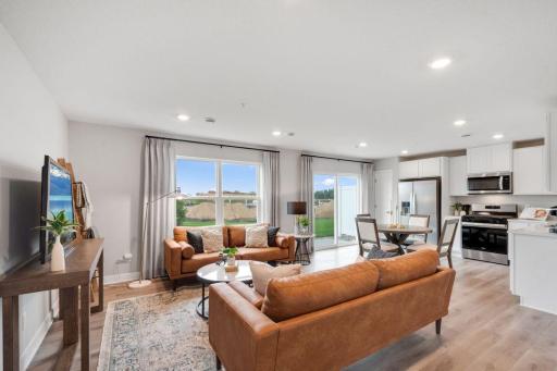 This end unit, Fender floorplan has a lovely open concept living area. Model photo. Options and colors will vary.