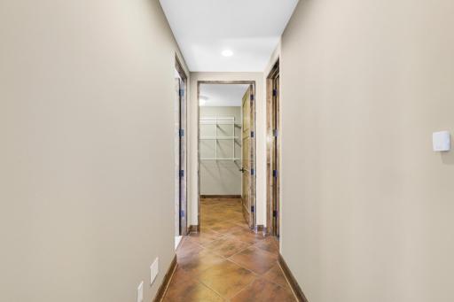 The walkout lower level is set for entertaining lake guests, boasting a fully equipped bar attached to the media room, a climate-controlled wine room, a tasting room, a 5th bedroom, additional storage, and a lake storage room with a 2nd laundry.