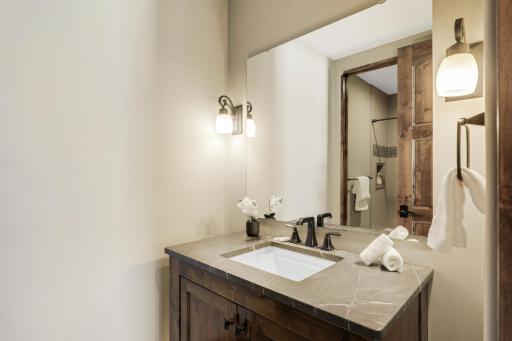 This full bathroom serves the lower-level bedroom and common spaces.