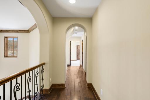 The upper-level hosts three additional bedrooms supported by two additional bathrooms, a well-appointed laundry room and a reading nook overlooking the great room.