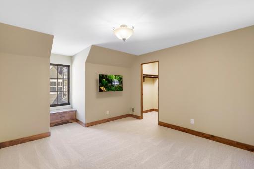 The upper-level hosts three additional bedrooms supported by two additional bathrooms, a well-appointed laundry room and a reading nook overlooking the great room.