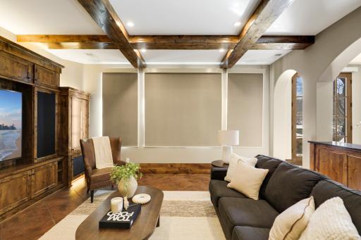 The walkout lower level is set for entertaining lake guests, boasting a fully equipped bar attached to the media room, a climate-controlled wine room, a tasting room, a 5th bedroom, additional storage, and a lake storage room with a 2nd laundry.