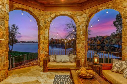 The home is set on a half-acre, walkout elevation with a very gentle slope to 133â of sandy, clear, SE facing shoreline on Smithtown Bay, one of Lake Minnetonkaâs clearest bays.