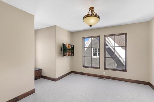 The upper-level hosts three additional bedrooms supported by two additional bathrooms, a well-appointed laundry room and a reading nook overlooking the great room.