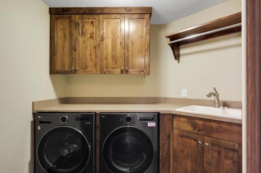 The upper-level hosts three additional bedrooms supported by two additional bathrooms, a well-appointed laundry room and a reading nook overlooking the great room.