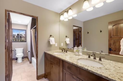 The upper-level hosts three additional bedrooms supported by two additional bathrooms, a well-appointed laundry room and a reading nook overlooking the great room.