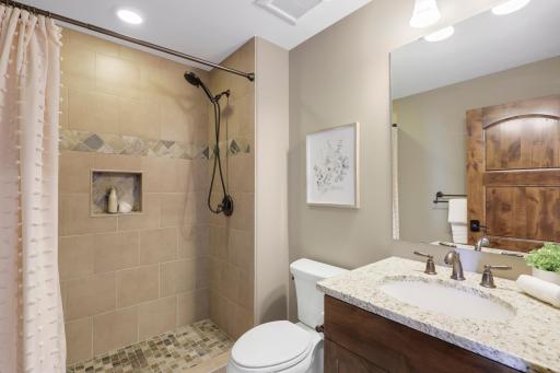 The upper-level hosts three additional bedrooms supported by two additional bathrooms, a well-appointed laundry room and a reading nook overlooking the great room.
