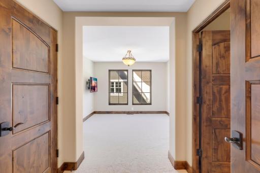 The upper-level hosts three additional bedrooms supported by two additional bathrooms, a well-appointed laundry room and a reading nook overlooking the great room.