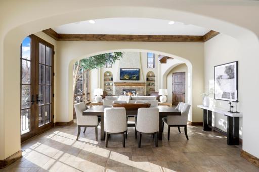 The dining room is open to the kitchen and great room. French doors in the dining room open up to a Juliet balcony.