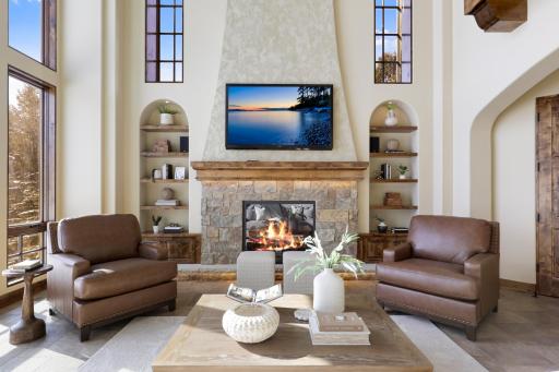 High-end finishes/features include a bright, open floorplan, massive ceiling vaults, heated porcelain tile floors, 8â doors, rounded archways, extensive knotty alder millwork, magnificent stonework, and so much more.