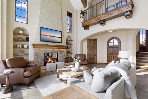 High-end finishes/features include a bright, open floorplan, massive ceiling vaults, heated porcelain tile floors, 8â doors, rounded archways, extensive knotty alder millwork, magnificent stonework, and so much more.