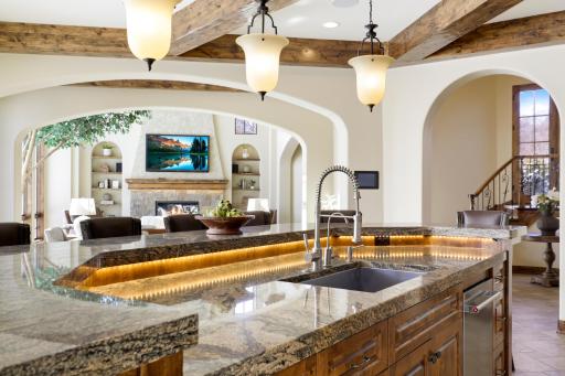 Experience expansive views of Smithtown Bay while cooking in your opulent chefâs kitchen, featuring Wolf and Sub-Zero appliances, natural stone countertops, and a walk-in pantry.