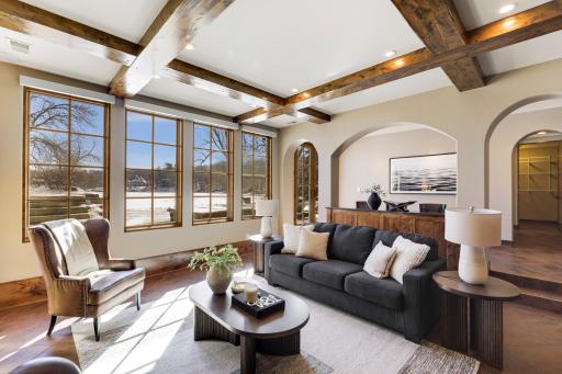 The walkout lower level is set for entertaining lake guests, boasting a fully equipped bar attached to the media room, a climate-controlled wine room, a tasting room, a 5th bedroom, additional storage, and a lake storage room with a 2nd laundry.