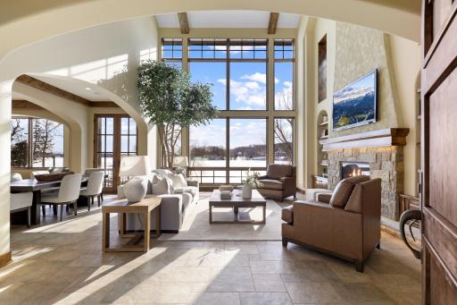 Natural daylight floods the main floor through the SE facing wall of floor-to-ceiling windows from dawn until early afternoon, making way for cooling shade from afternoon to dusk.