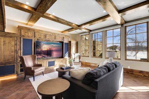 The walkout lower level is set for entertaining lake guests, boasting a fully equipped bar attached to the media room, a climate-controlled wine room, a tasting room, a 5th bedroom, additional storage, and a lake storage room with a 2nd laundry.