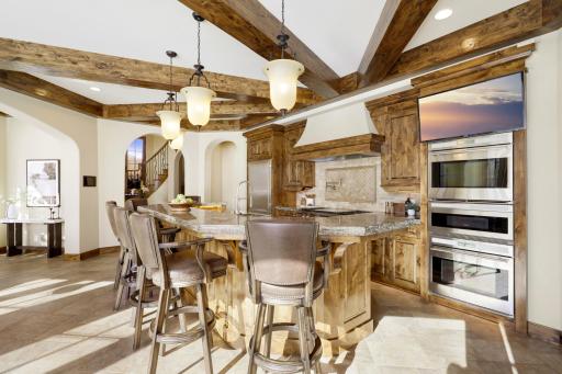 Experience expansive views of Smithtown Bay while cooking in your opulent chefâs kitchen, featuring Wolf and Sub-Zero appliances, natural stone countertops, and a walk-in pantry.