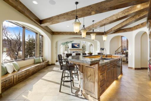 Experience expansive views of Smithtown Bay while cooking in your opulent chefâs kitchen, featuring Wolf and Sub-Zero appliances, natural stone countertops, and a walk-in pantry.
