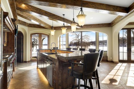 Experience expansive views of Smithtown Bay while cooking in your opulent chefâs kitchen, featuring Wolf and Sub-Zero appliances, natural stone countertops, and a walk-in pantry.