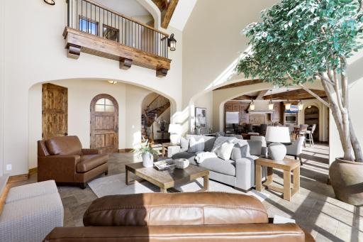 High-end finishes/features include a bright, open floorplan, massive ceiling vaults, heated porcelain tile floors, 8â doors, rounded archways, extensive knotty alder millwork, magnificent stonework, and so much more.
