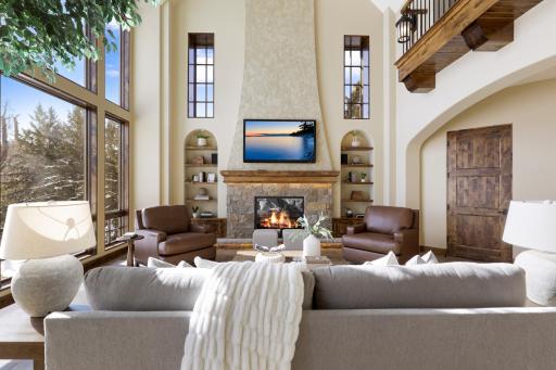 High-end finishes/features include a bright, open floorplan, massive ceiling vaults, heated porcelain tile floors, 8â doors, rounded archways, extensive knotty alder millwork, magnificent stonework, and so much more.