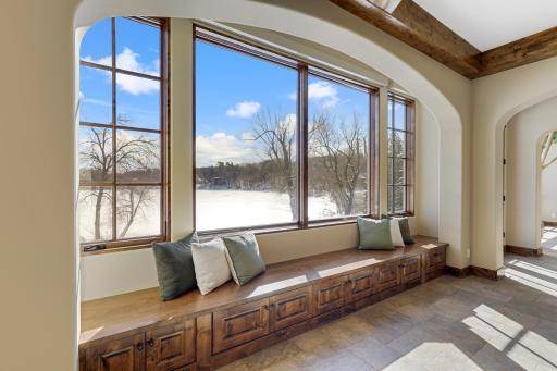 Experience expansive views of Smithtown Bay while cooking in your opulent chefâs kitchen, featuring Wolf and Sub-Zero appliances, natural stone countertops, and a walk-in pantry.