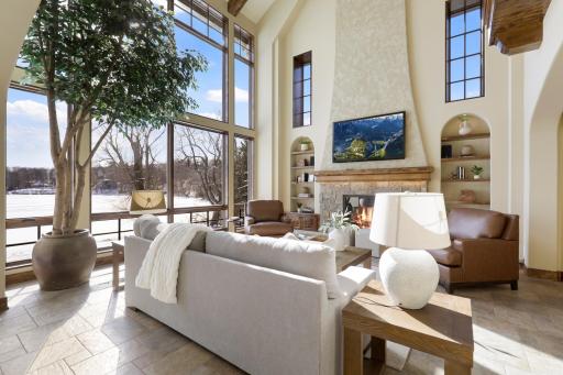 Natural daylight floods the main floor through the SE facing wall of floor-to-ceiling windows from dawn until early afternoon, making way for cooling shade from afternoon to dusk.