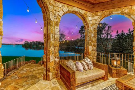 Possibly the most utilized room in the home, the California room, positioned next to the kitchen, offers a wood-fired pizza oven, a built-in gas grill, an outdoor TV, and motorized Phantom screens.