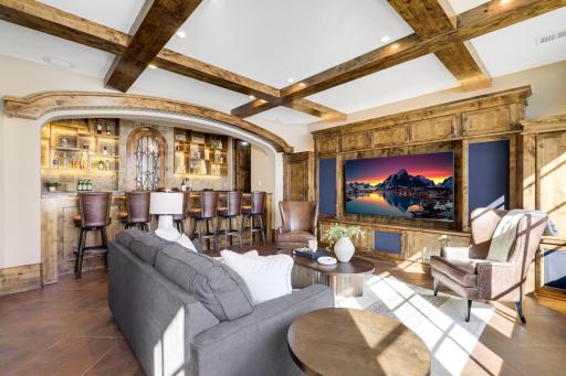 The walkout lower level is set for entertaining lake guests, boasting a fully equipped bar attached to the media room, a climate-controlled wine room, a tasting room, a 5th bedroom, additional storage, and a lake storage room with a 2nd laundry.