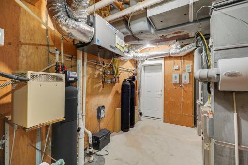 The white door leads to the hot tub mechanical room and hosts the homes 2 geothermal units.