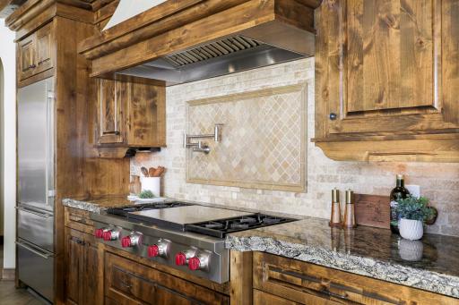 Experience expansive views of Smithtown Bay while cooking in your opulent chefâs kitchen, featuring Wolf and Sub-Zero appliances, natural stone countertops, and a walk-in pantry.