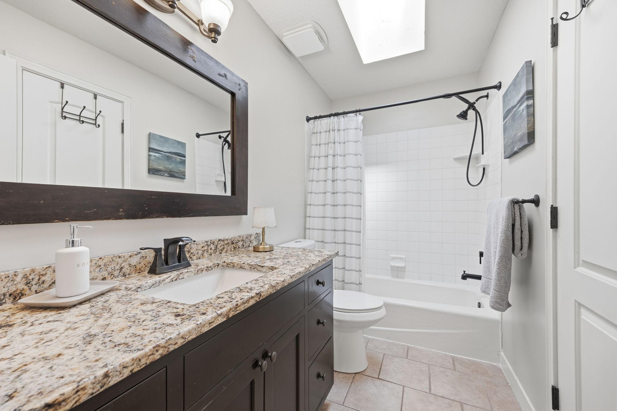 Bathroom has HEATED FLOORS and skylight!