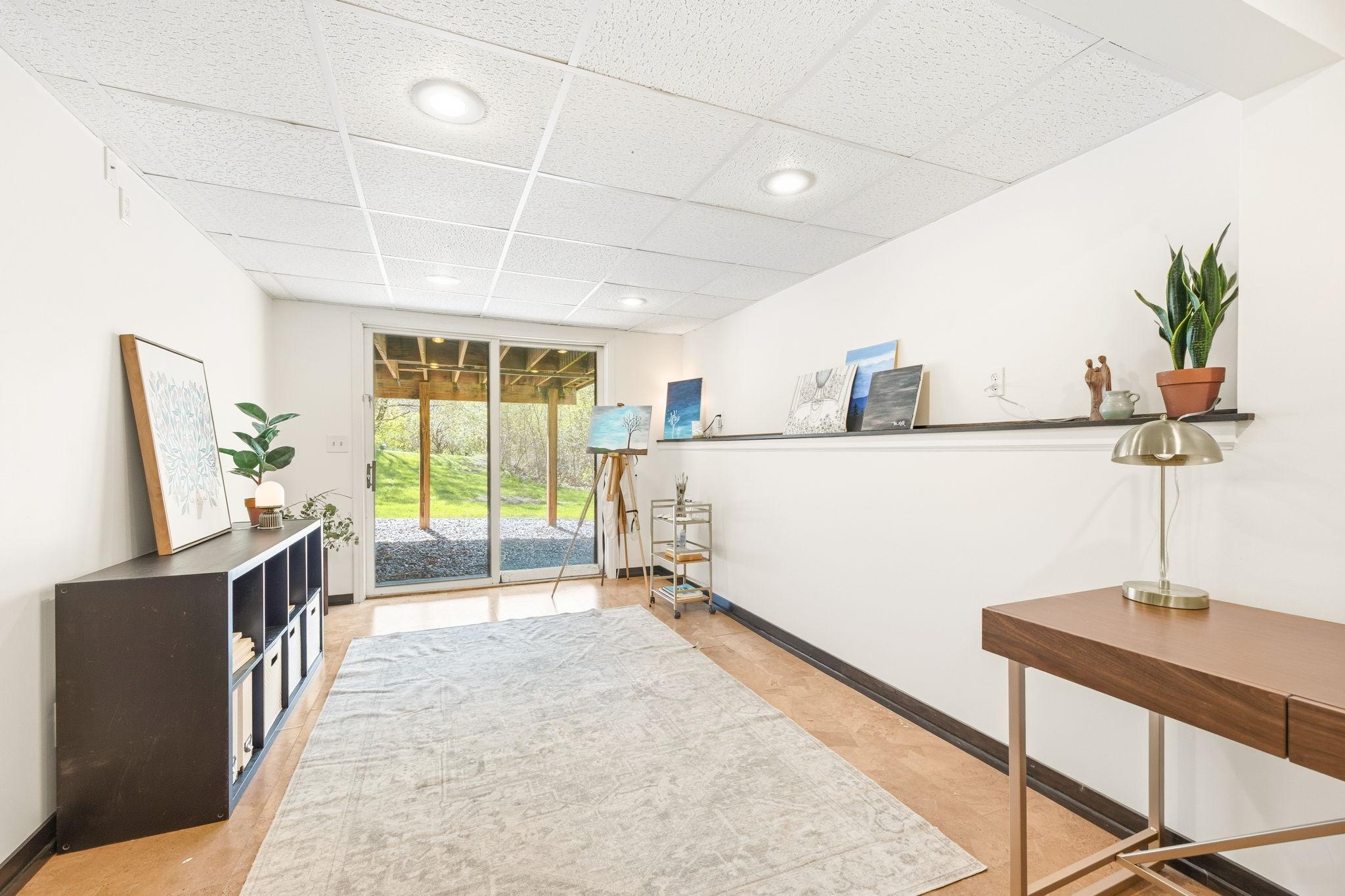 This awesome space is currently the Art Studio! Could be the playroom, craft room, or ...? Walks out to the backyard, too!