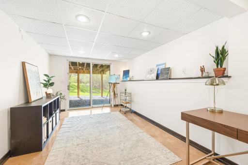 This awesome space is currently the Art Studio! Could be the playroom, craft room, or ...? Walks out to the backyard, too!