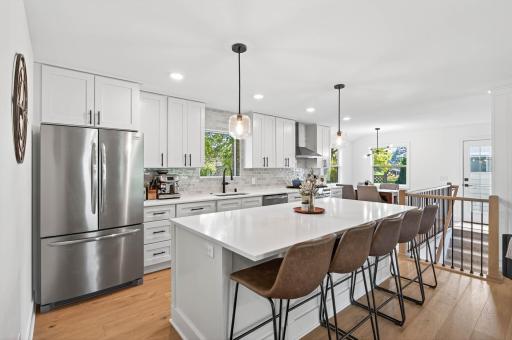 Photo for 6301 Saint Johns Avenue, Edina, MN 55424 - listing #6810304 Beautiful custom kitchen features large 4'x8' center island with seating for up to five.