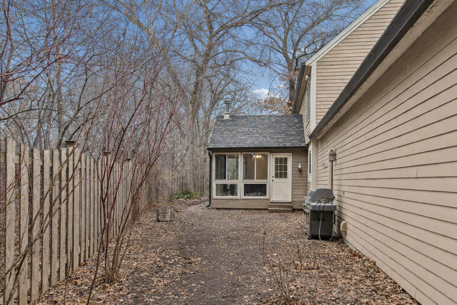 Outdoor space including pavers and water feature