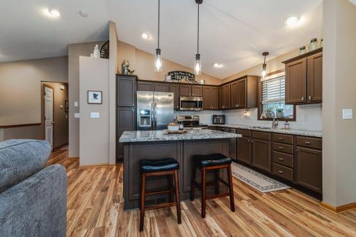 Open with knock down ceilings, beautiful light fixtures, recess lighting through out main floor,