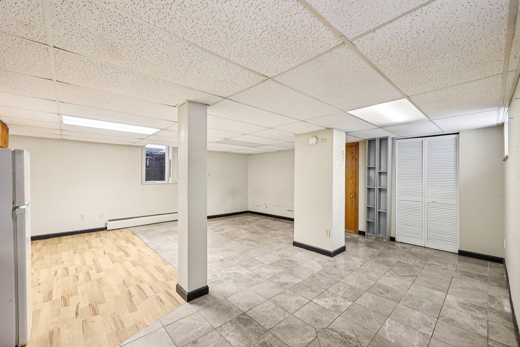 Lower level studio - could be converted to a triplex!