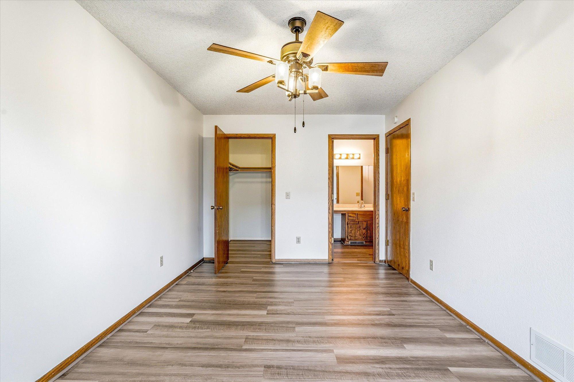 Large walk-in closet and entry into bathroom