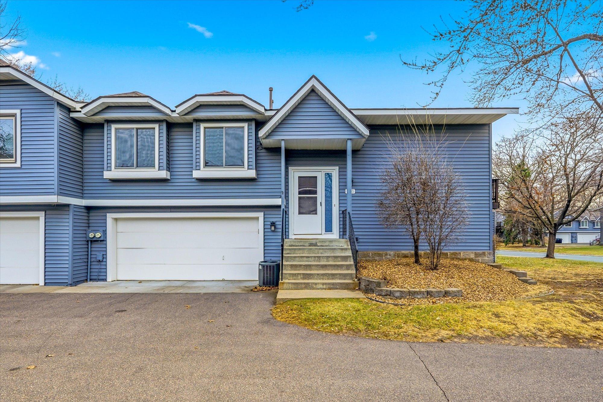 Experience easy living in this bi-level townhome