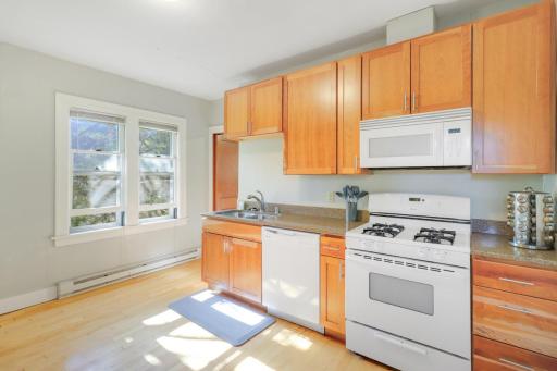 All white appliances create a clean, cohesive look that is easy to maintain.